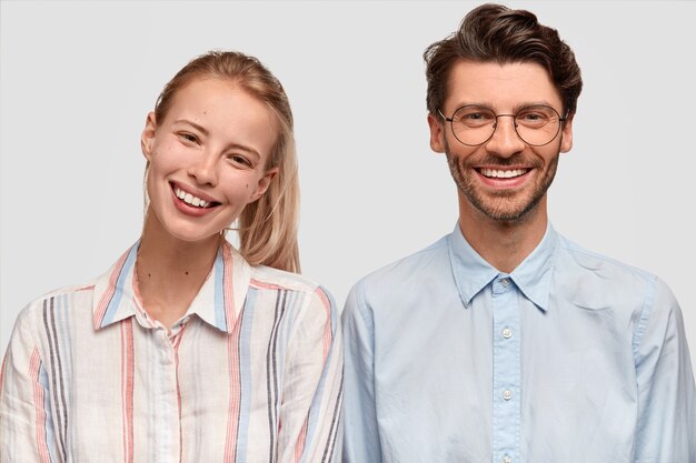 Man and woman in formal clothes posing