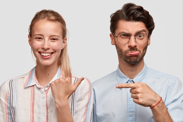 Free photo man and woman in formal clothes posing