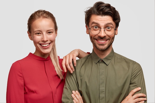 Free photo man and woman in formal clothes posing