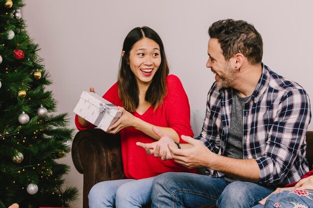 Man and woman gifting each other