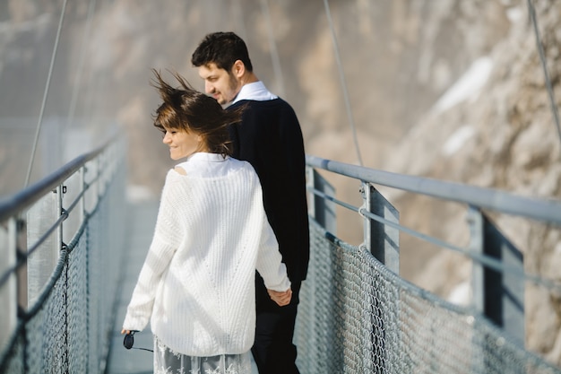 Man and woman going through bridge together