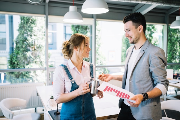 Man and woman having chat in office