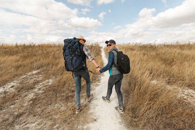 Man and woman holding hands outdoors