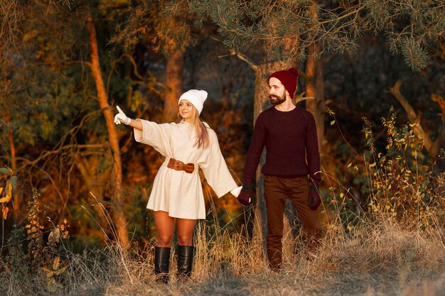 Man and woman holding hands outdoors