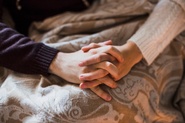 Man and woman holding hands