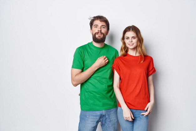 Man and woman hug friendship colorful tshirts family light background Premium Photo