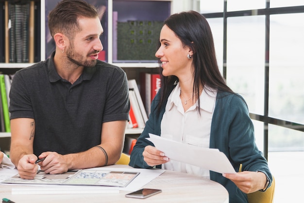 Man and woman interacting in office