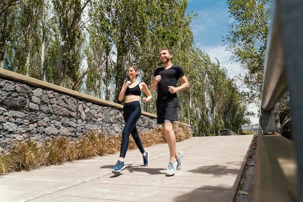 Man and woman jogging together outdoors