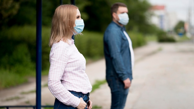 Man and woman keeping social distance