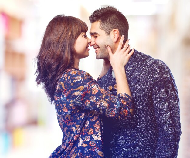 Man and woman kissing pointed