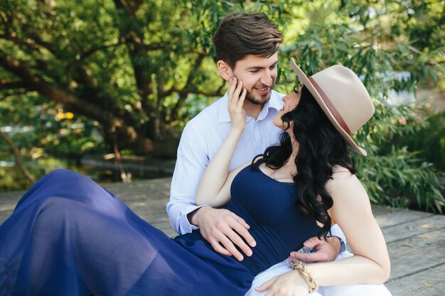 Man and woman at the lake to spend time in each other's arms