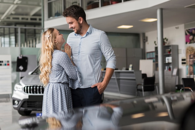 Man and woman looking at each other in a showroom