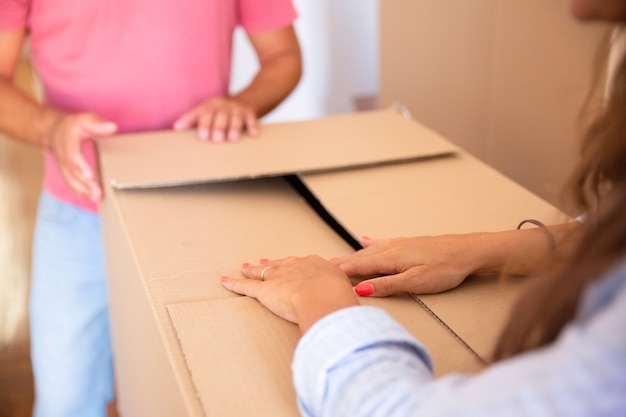 Man and woman moving and unpacking things