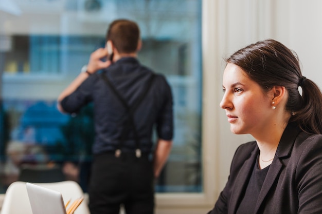 Man and woman in office together