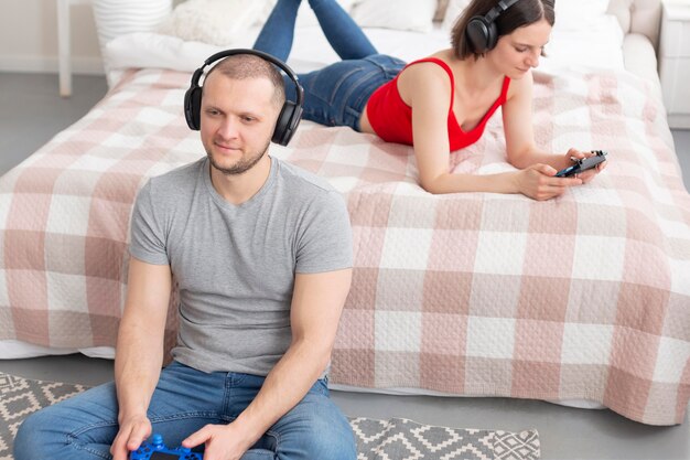 Man and woman playing videogames