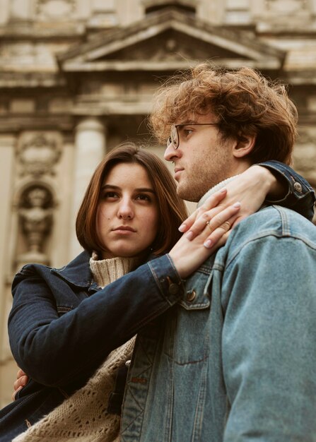 Man and woman posing hugged