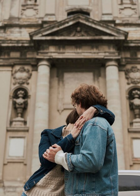 Man and woman posing hugged