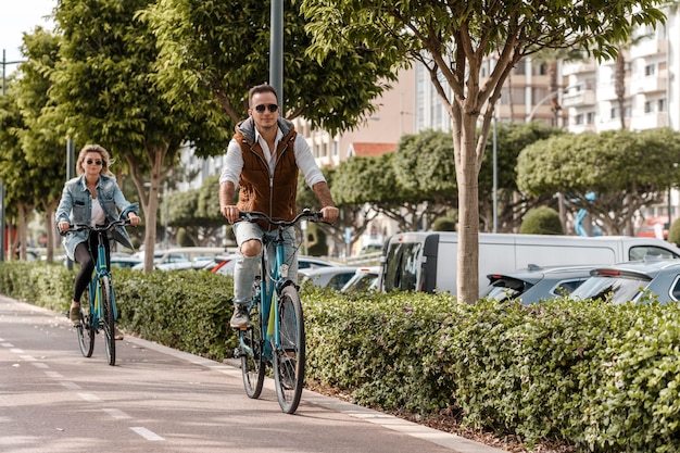 man and woman riding their bikes