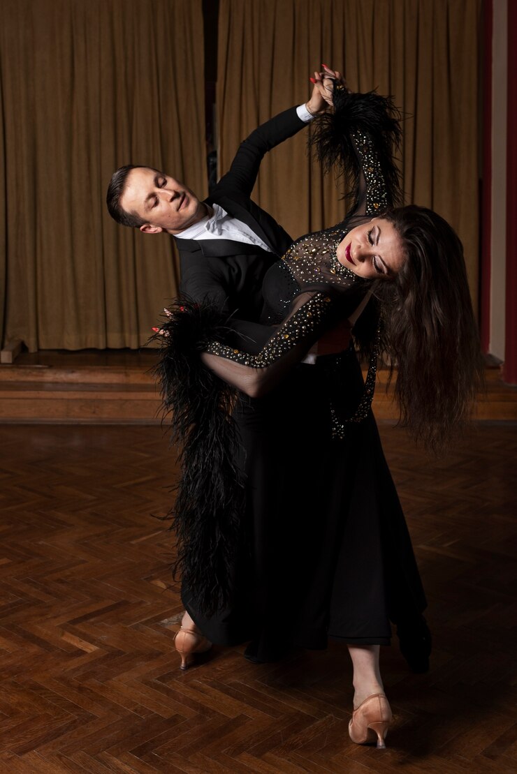 Free Photo man and woman showing ballroom dancing together