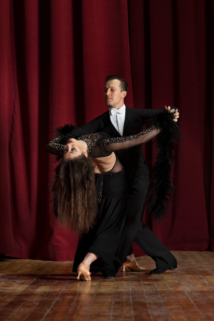 Free Photo man and woman showing ballroom dancing together