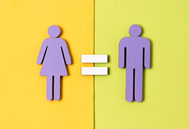 Man and woman standing  with equal sign between them