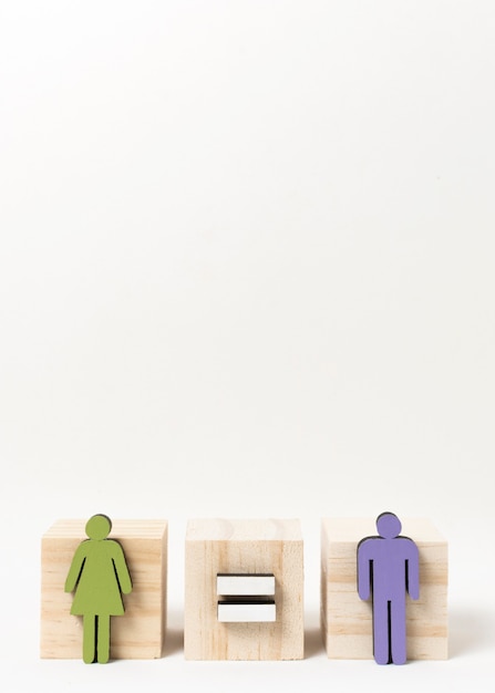 Man and woman standing on wooden blocks copy space