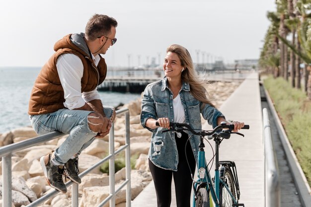 Man and woman talking next to a bike