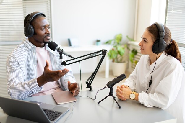 Man and woman talking in a podcast