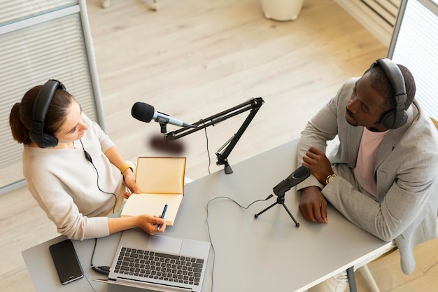 Man and woman talking in a podcast