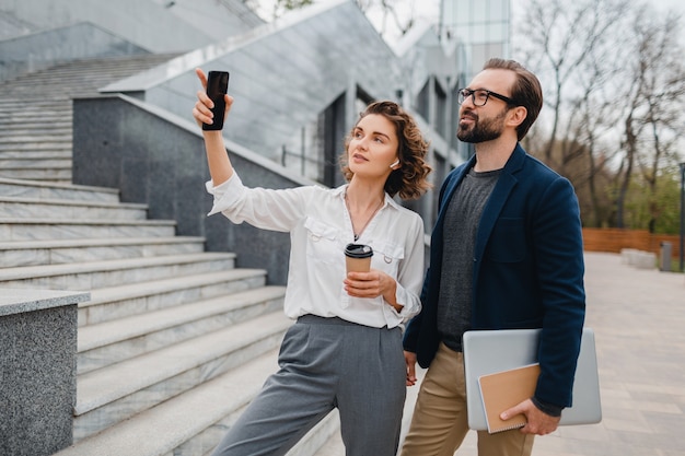 Man and woman talking in urban city center