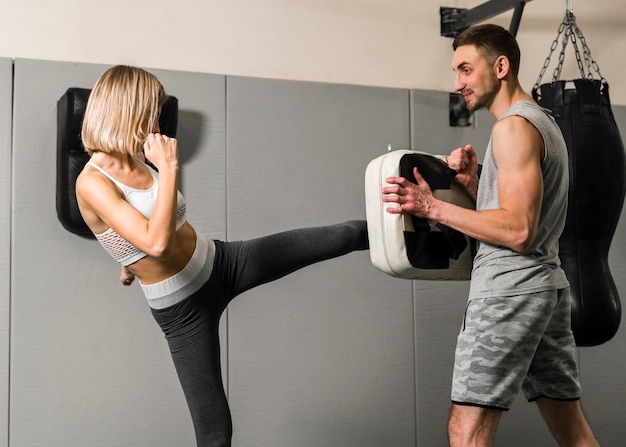 Man and woman training at the gym