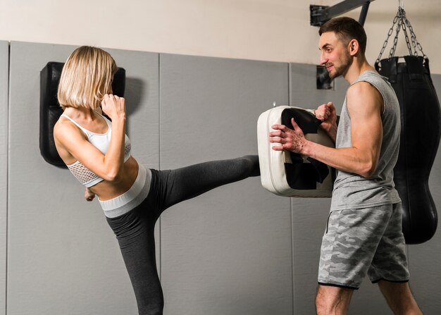 Man and woman training at the gym