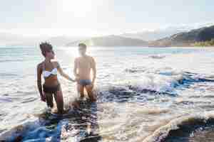 Free photo man and woman in the water