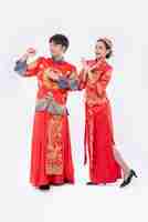 Free photo man and woman wear cheongsam suit glad the event will be occur on chinese new year