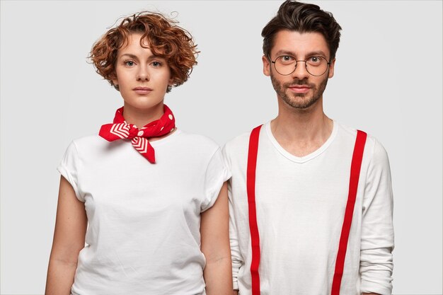 Man and woman wearing white T-shirts posing