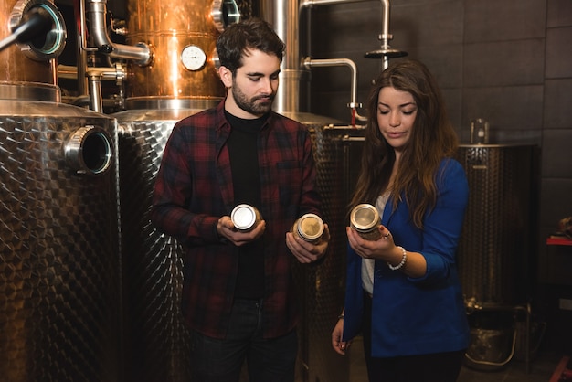 Man and woman working in beer factory