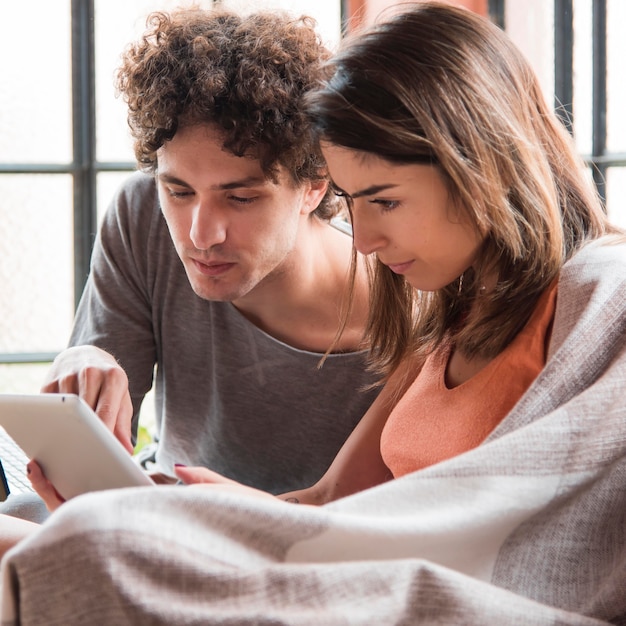 Free photo man and woman working at home