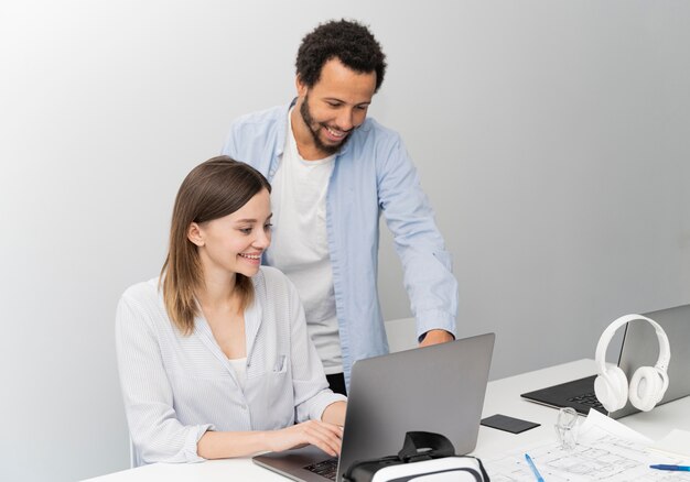 Man and woman working on power saving solutions together