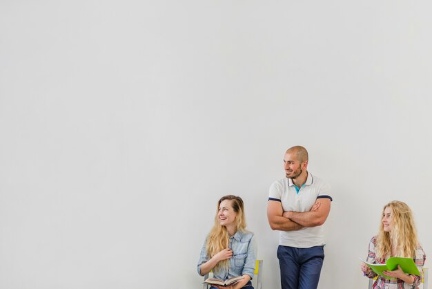 Man and women with notepads