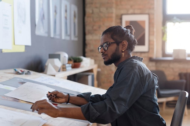 Free photo man working in an animation studio