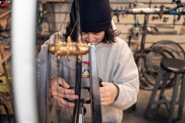 Man working at bike shop medium shot