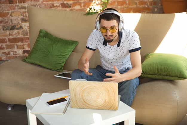 Man working from home during coronavirus or COVID-19 quarantine, remote office concept