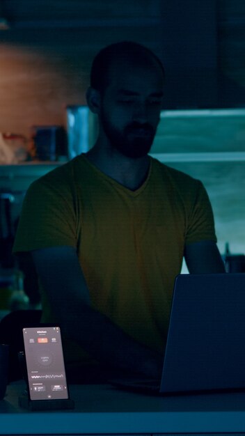 Man working from smart house with automation lighting system