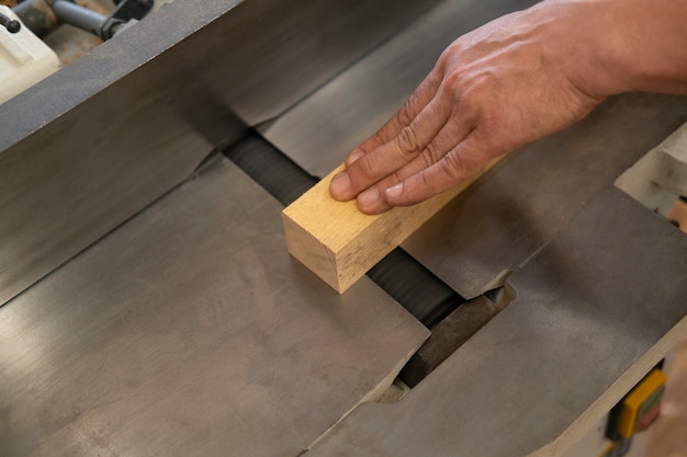 Man working in his wood shop with tools and equipment