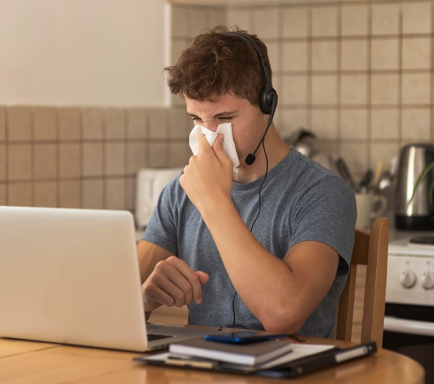 Man working in the kitchen at home during quarantine