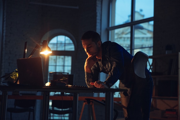 Man working in office alone