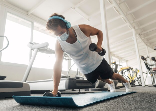 Man working out on mat at the gym