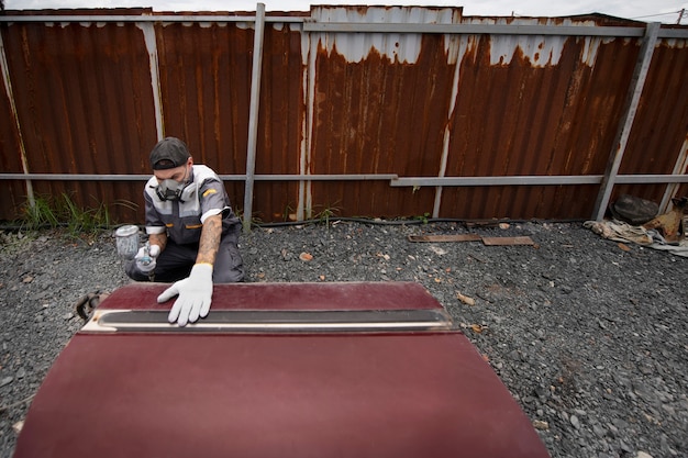 Free photo man working outdoors high angle