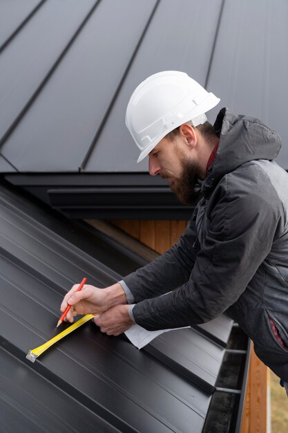 Man working on roof medium shot