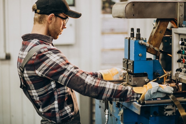 Man working on steel fatory and equipment for steel production